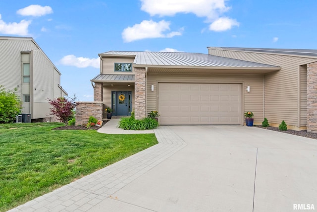 321 Harbor Point Pl, Springfield, IL 62712 - view of front of property with a standing seam roof, an attached garage, metal roof, driveway, and a front yard