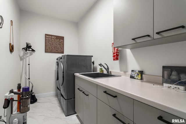 321 Harbor Point Pl, Springfield, IL 62712 - laundry area with cabinet space, light marble finish flooring, washing machine and dryer, and baseboards