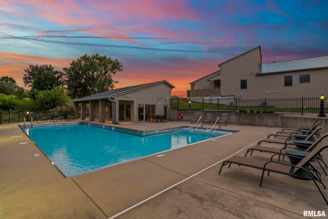 321 Harbor Point Pl, Springfield, IL 62712 - pool at dusk with a patio, fence, and a community pool