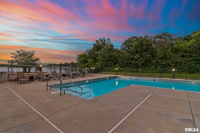 321 Harbor Point Pl, Springfield, IL 62712 - pool at dusk with a community pool, fence, a patio, and a water view