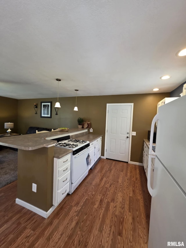 514 W Washington St, Mendon, IL 62351 - kitchen with white appliances, a peninsula, white cabinets, dark wood-style flooring, and recessed lighting