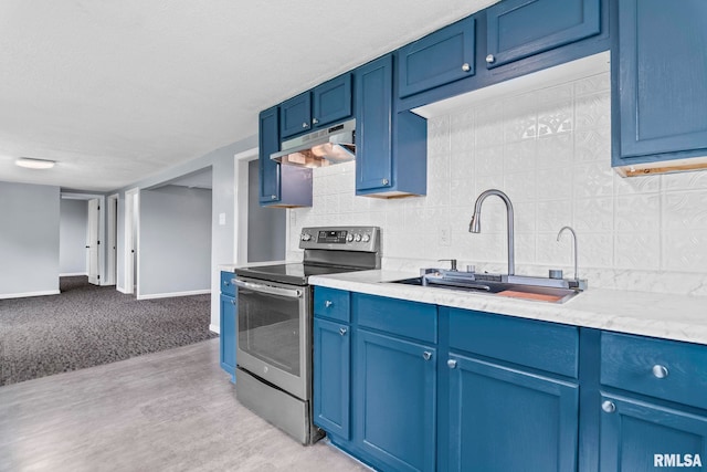 kitchen featuring stainless steel electric range oven, under cabinet range hood, blue cabinets, and a sink