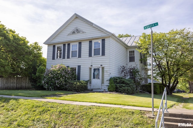 309 W State St, Payson, IL 62360 - view of front of home with a standing seam roof and metal roof