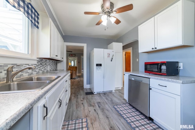 309 W State St, Payson, IL 62360 - kitchen with dishwasher, white refrigerator with ice dispenser, black microwave, a sink, and white cabinets
