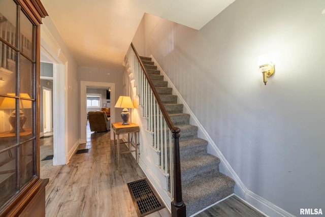 309 W State St, Payson, IL 62360 - stairway with wood finished floors and baseboards
