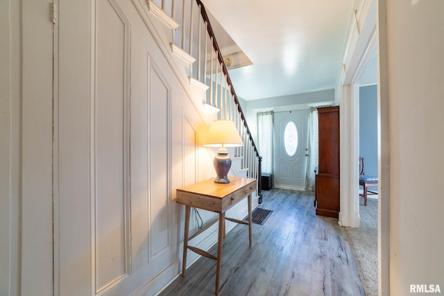 309 W State St, Payson, IL 62360 - foyer with stairway, light wood-style flooring, and a decorative wall