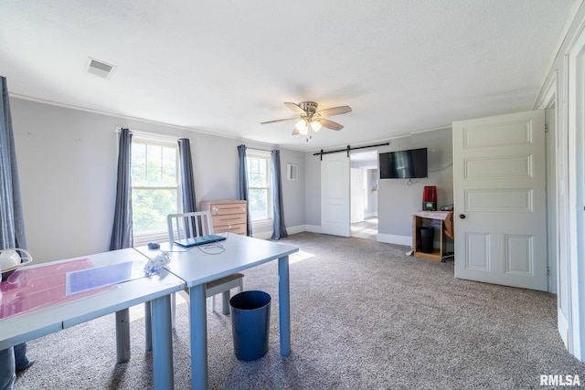309 W State St, Payson, IL 62360 - office area featuring a barn door, light colored carpet, ceiling fan, baseboards, and crown molding