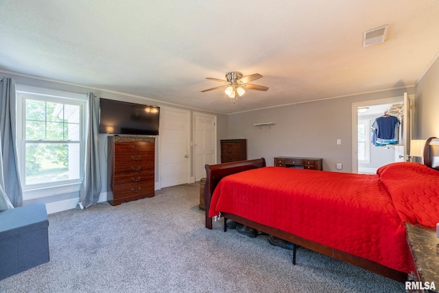 309 W State St, Payson, IL 62360 - carpeted bedroom featuring crown molding, a ceiling fan, and baseboards