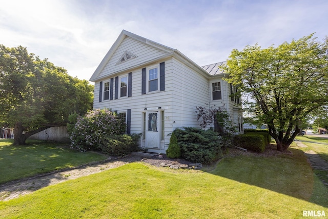 309 W State St, Payson, IL 62360 - view of front of home with a standing seam roof and metal roof