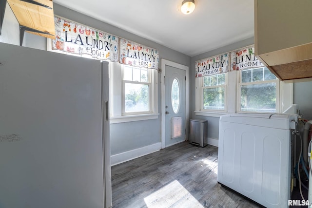 309 W State St, Payson, IL 62360 - kitchen featuring freestanding refrigerator, healthy amount of natural light, wood finished floors, and baseboards