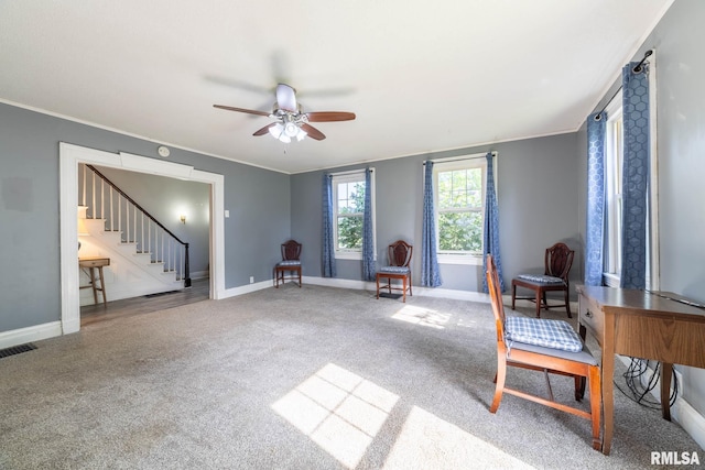309 W State St, Payson, IL 62360 - sitting room featuring a ceiling fan, stairs, crown molding, carpet, and baseboards