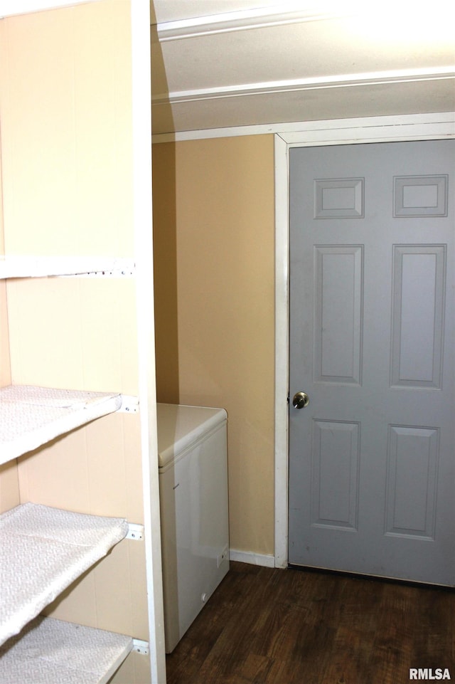 214 W B St, Alpha, IL 61413 - laundry area with dark wood-style floors and baseboards