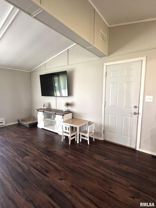 209 Brookview Dr, Abingdon, IL 61410 - living area featuring wood finished floors, crown molding, vaulted ceiling, and baseboards