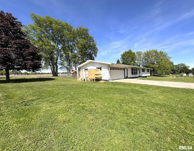 209 Brookview Dr, Abingdon, IL 61410 - view of front of home featuring driveway, an attached garage, and a front lawn