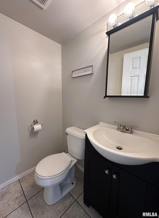209 Brookview Dr, Abingdon, IL 61410 - bathroom featuring toilet, tile patterned flooring, vanity, a textured ceiling, and baseboards
