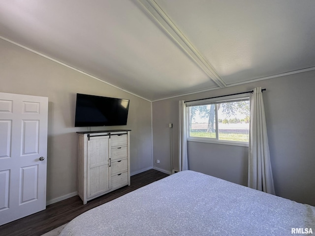 209 Brookview Dr, Abingdon, IL 61410 - bedroom featuring vaulted ceiling, dark wood-style flooring, and baseboards