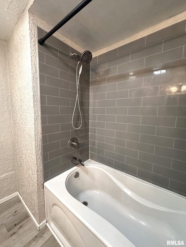 209 Brookview Dr, Abingdon, IL 61410 - full bath featuring wood finished floors, a textured wall, bathtub / shower combination, and baseboards