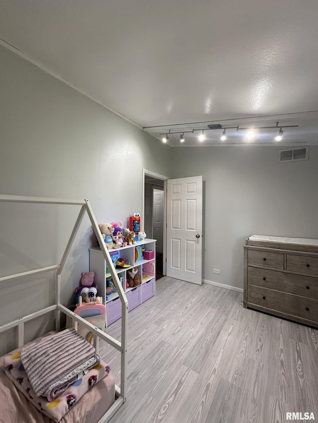 209 Brookview Dr, Abingdon, IL 61410 - bedroom with track lighting, wood finished floors, and baseboards
