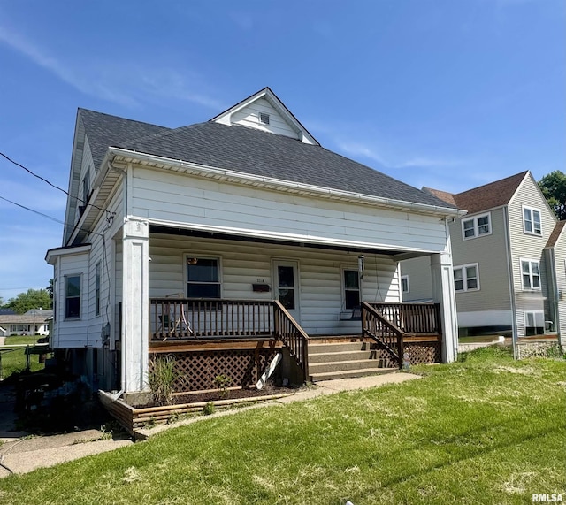 3210 Rendlen Ave, Hannibal-Mo, MO 63401 - rear view of property with a porch, a yard, and a shingled roof