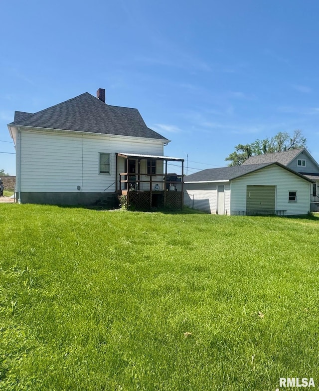 3210 Rendlen Ave, Hannibal-Mo, MO 63401 - back of house with a yard and a chimney