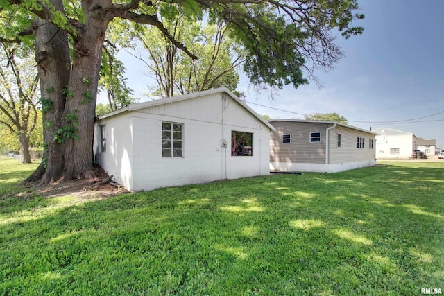 rear view of house with a lawn