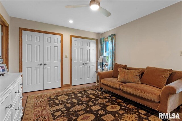 living room with a ceiling fan, light wood-style flooring, and recessed lighting