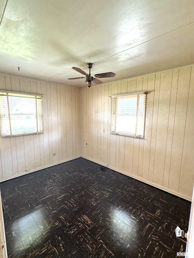 461 W Fremont St, Galesburg, IL 61401 - unfurnished room featuring ceiling fan and wood walls
