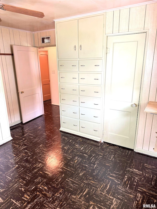 461 W Fremont St, Galesburg, IL 61401 - unfurnished bedroom featuring mail area and dark floors