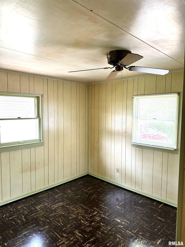 461 W Fremont St, Galesburg, IL 61401 - empty room featuring a ceiling fan and wood walls