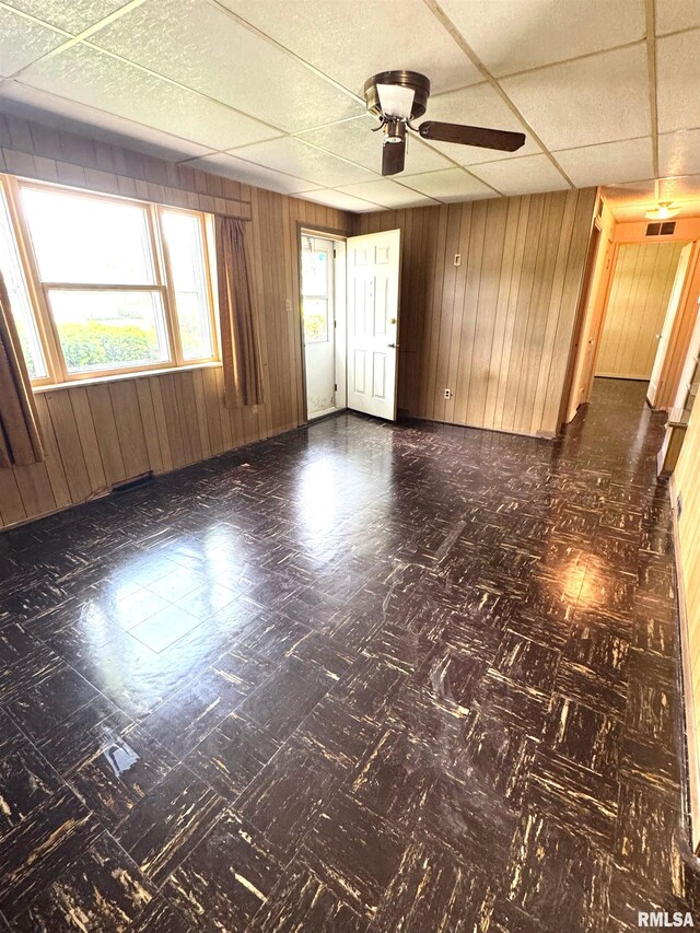 461 W Fremont St, Galesburg, IL 61401 - spare room with wooden walls and a ceiling fan
