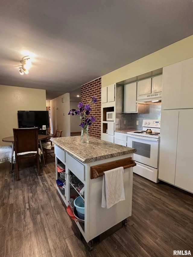 810 NW 7th Ave, Galva, IL 61434 - kitchen featuring white appliances, under cabinet range hood, dark wood-style floors, a center island, and white cabinetry
