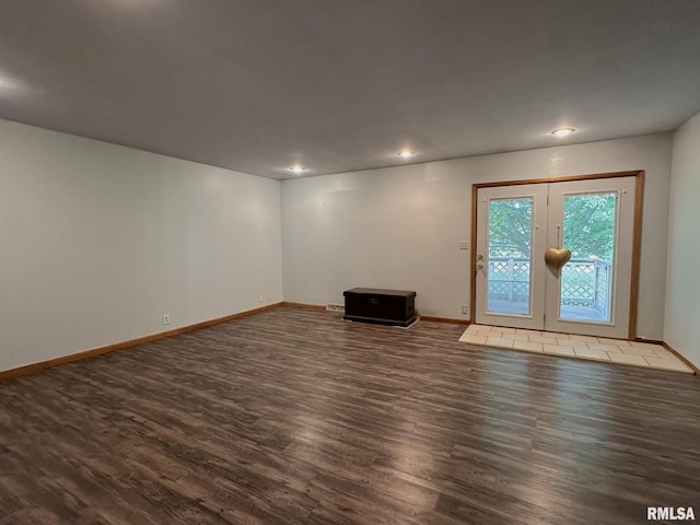 810 NW 7th Ave, Galva, IL 61434 - empty room featuring dark wood-style floors, french doors, baseboards, and recessed lighting