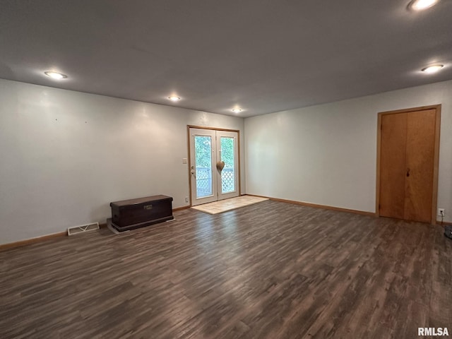 810 NW 7th Ave, Galva, IL 61434 - spare room featuring dark wood finished floors, baseboards, french doors, and recessed lighting