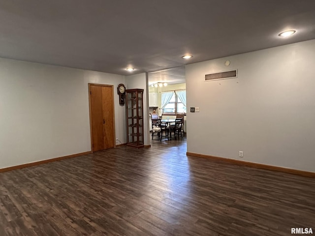 810 NW 7th Ave, Galva, IL 61434 - spare room with dark wood-type flooring, baseboards, and recessed lighting