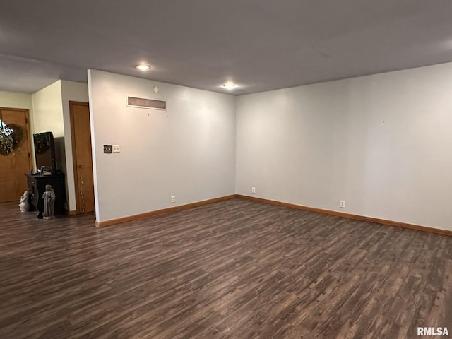 810 NW 7th Ave, Galva, IL 61434 - spare room with dark wood-style floors, baseboards, and recessed lighting