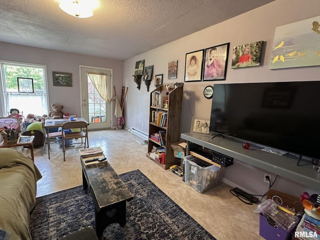 810 NW 7th Ave, Galva, IL 61434 - living area featuring a textured ceiling and a baseboard radiator