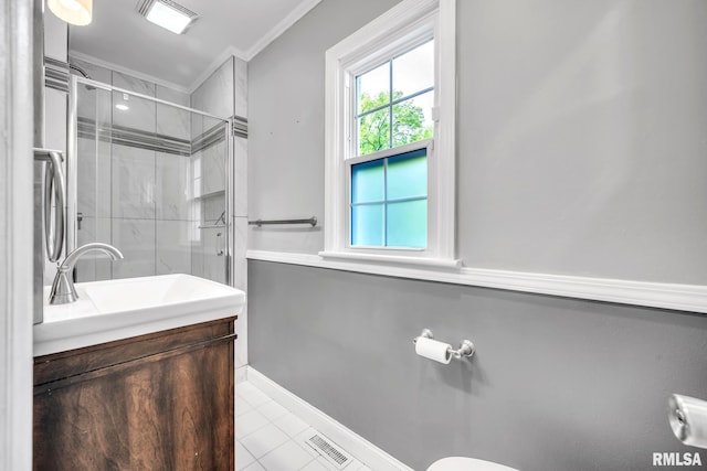 2255 N Broad St, Galesburg, IL 61401 - bathroom featuring ornamental molding, a stall shower, vanity, tile patterned flooring, and baseboards