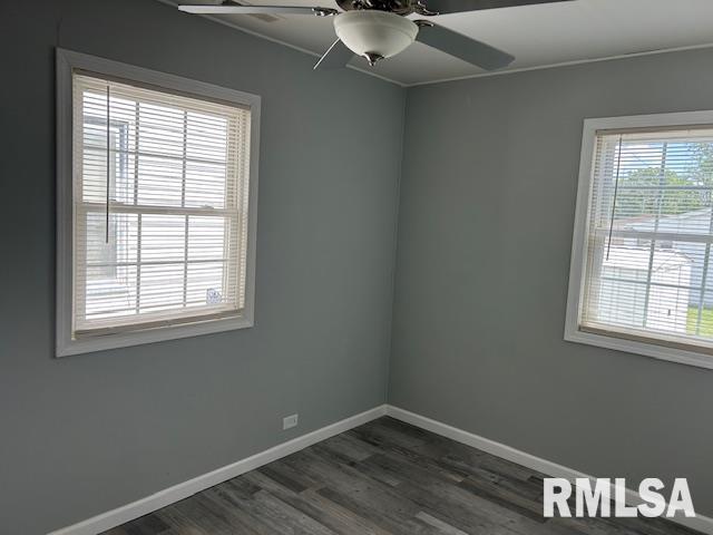 818 Van Buren St, Quincy, IL 62301 - empty room featuring a ceiling fan, dark wood finished floors, and baseboards