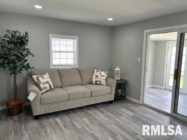818 Van Buren St, Quincy, IL 62301 - living area with wood finished floors, recessed lighting, and baseboards