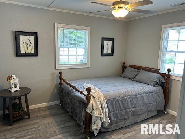818 Van Buren St, Quincy, IL 62301 - bedroom with wood finished floors, ornamental molding, baseboards, and ceiling fan