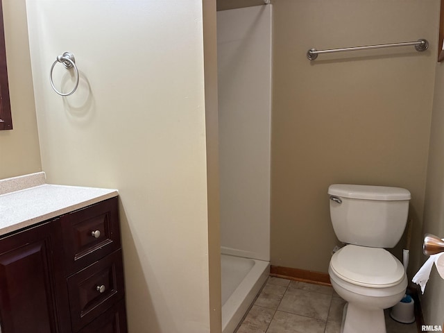 1744 Jackson St, Quincy, IL 62301 - full bathroom featuring vanity, toilet, a shower stall, tile patterned floors, and baseboards