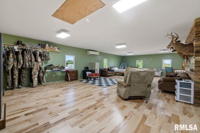 1460 Rushing Rd, Simpson, IL 62985 - living room with an AC wall unit, wood finished floors, and plenty of natural light