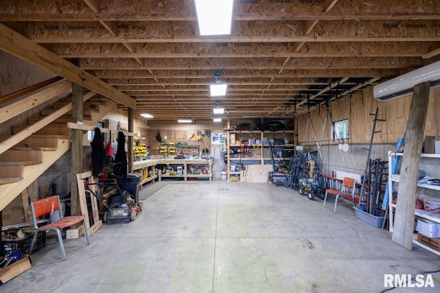 1460 Rushing Rd, Simpson, IL 62985 - garage with a workshop area and a wall mounted AC