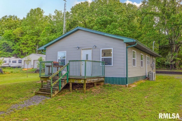 1460 Rushing Rd, Simpson, IL 62985 - view of front facade with a wooden deck, a front lawn, and central AC unit