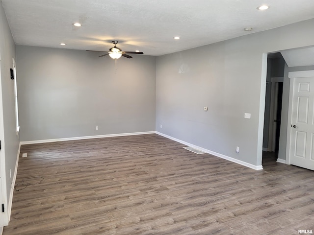 718 Adams St, Quincy, IL 62301 - empty room with a ceiling fan, baseboards, wood finished floors, and recessed lighting