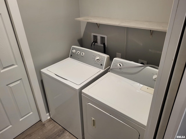 718 Adams St, Quincy, IL 62301 - clothes washing area featuring separate washer and dryer and wood finished floors