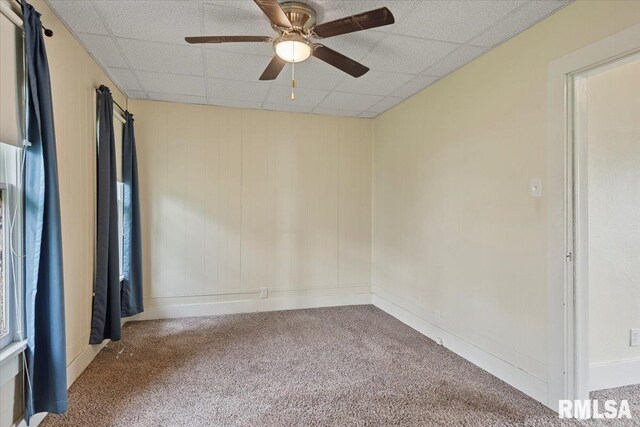 708 E 5th St, Pana, IL 62557 - carpeted spare room with ceiling fan and a paneled ceiling