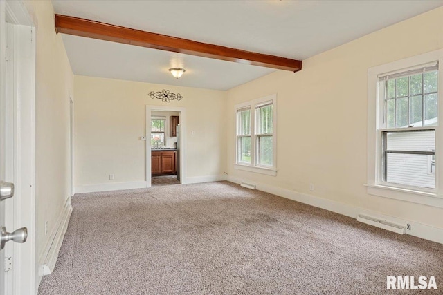 708 E 5th St, Pana, IL 62557 - carpeted spare room with beamed ceiling and baseboards