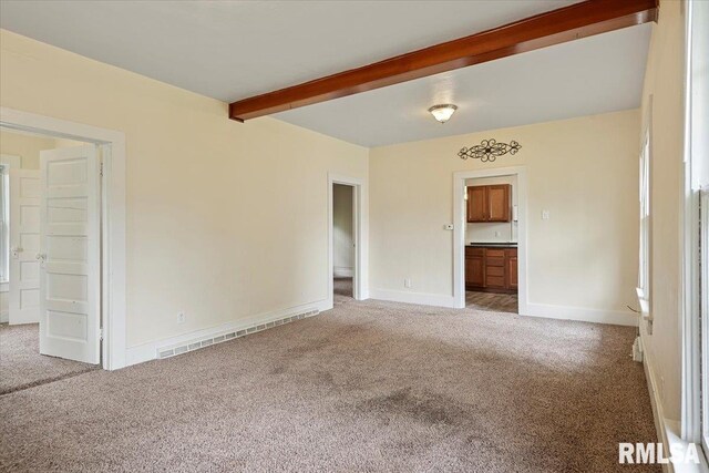 708 E 5th St, Pana, IL 62557 - spare room with light colored carpet and beamed ceiling