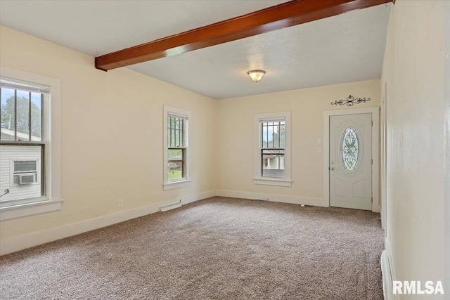 708 E 5th St, Pana, IL 62557 - carpeted entrance foyer with healthy amount of natural light and beamed ceiling